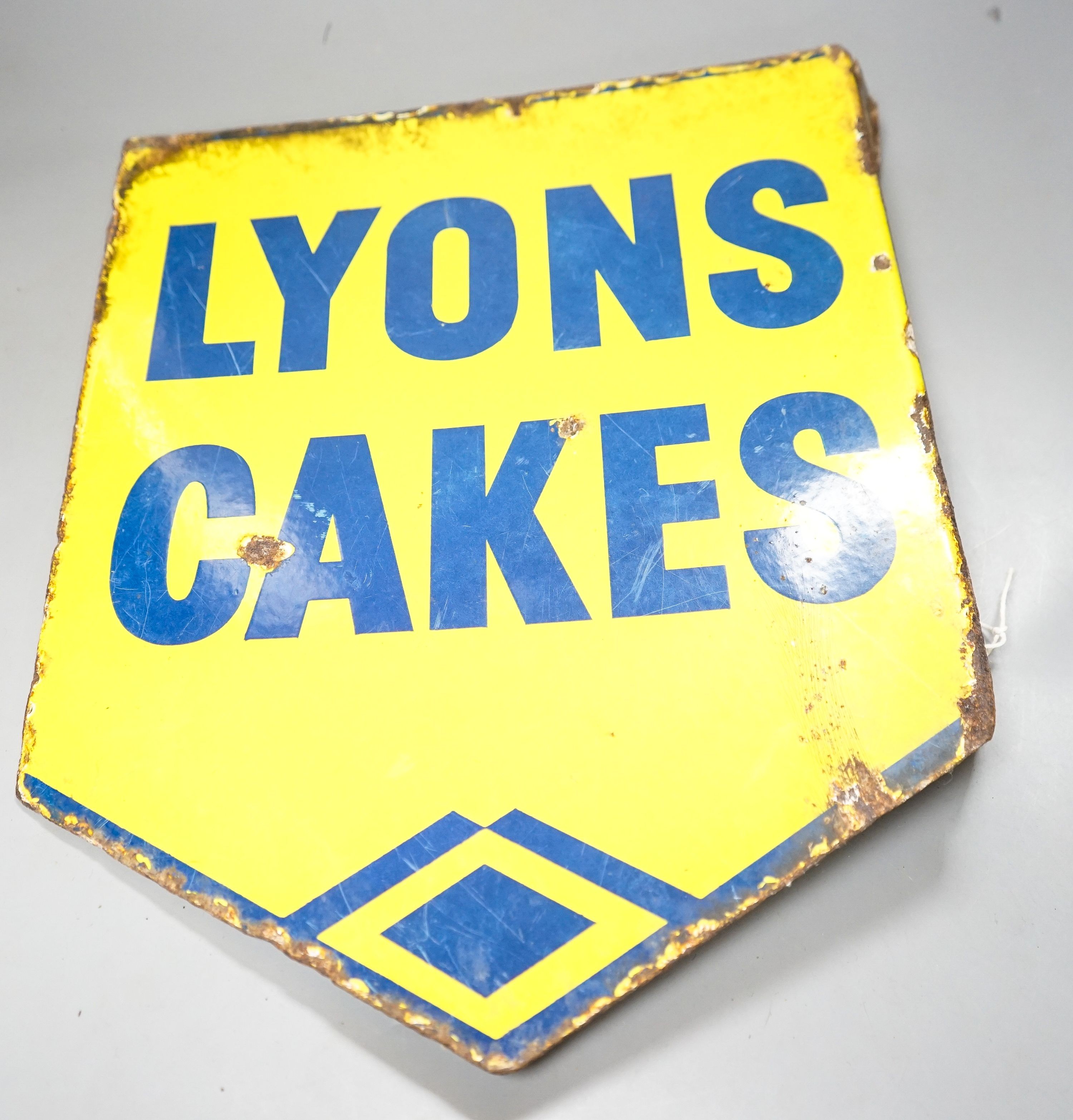 A Lyons Cakes yellow ground enamelled sign 40x32cm